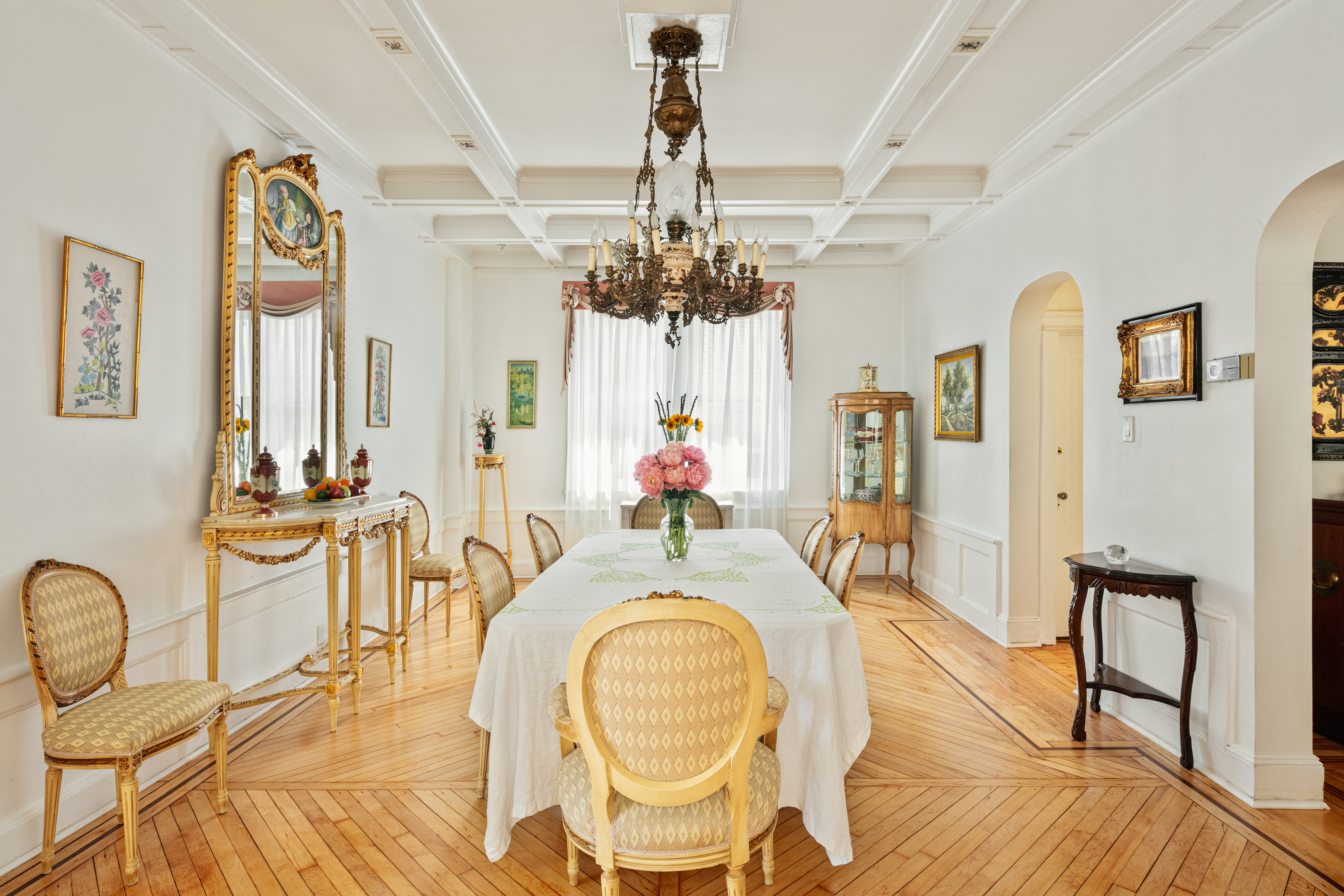 91 81st Street Brooklyn, NY 11209 - Photo 8 of 19 a dining room with chandelier fan and wooden floor