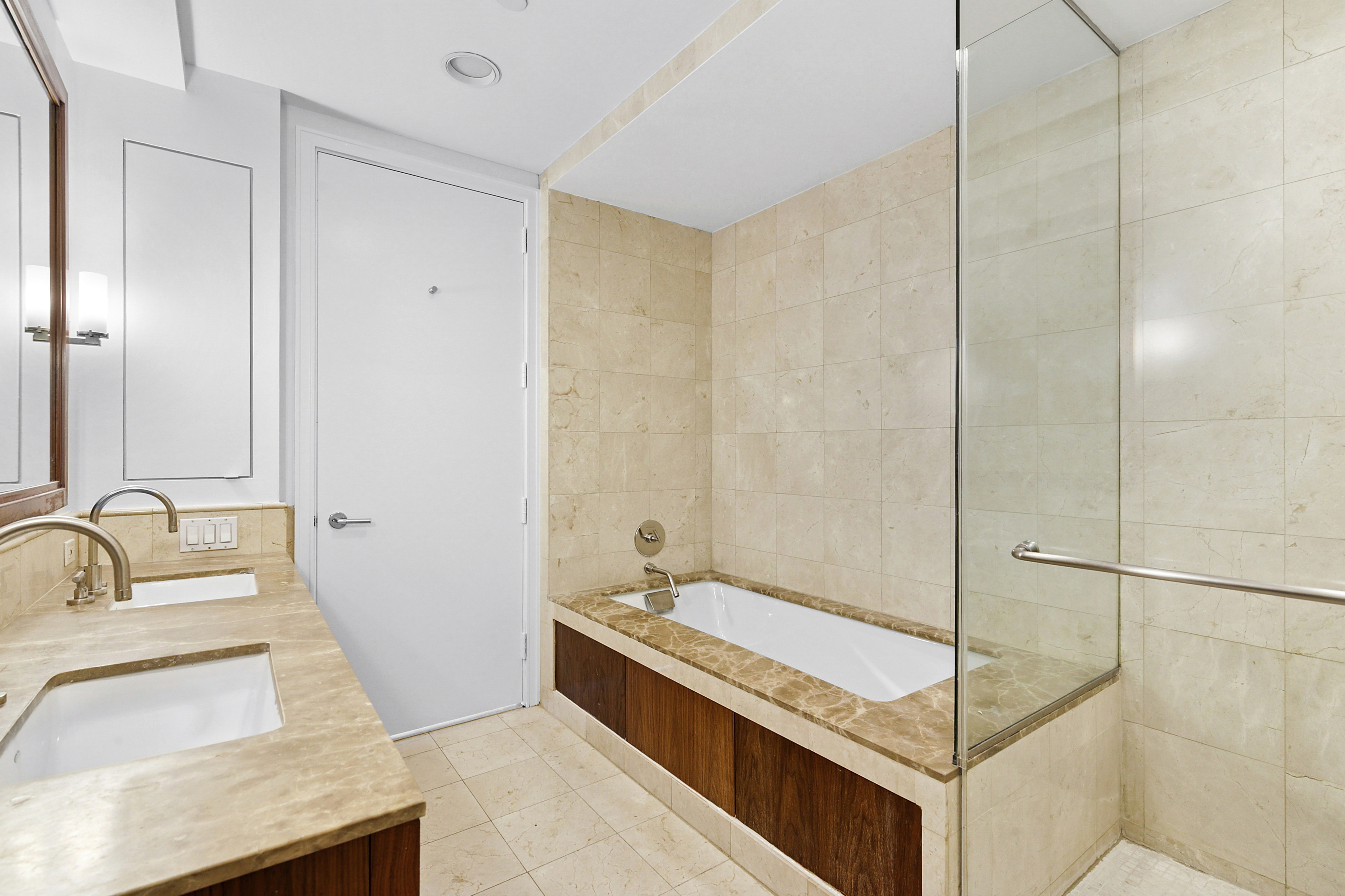 100 Morton Street, Unit 6CW Manhattan, NY 10014 - Photo 7 of 12 a bathroom with a tub sink and mirror