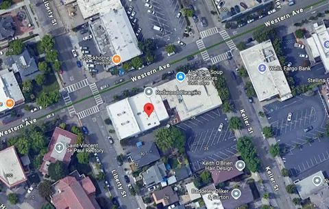 a view of a car parked in front of a building