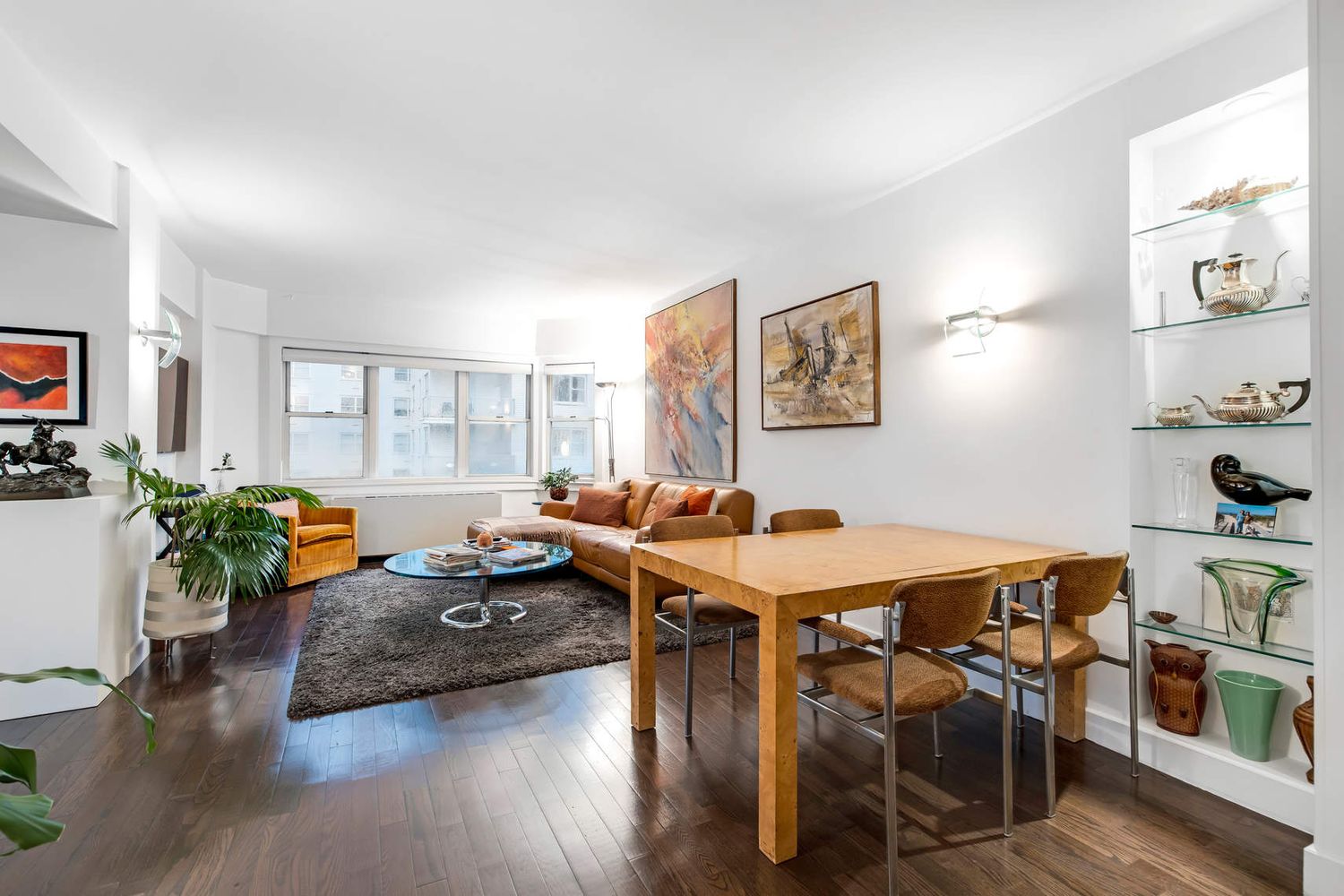 520 East 76th Street, Unit PHC Manhattan, NY 10021 - Photo 3 of 15 a view of a dining room with furniture window and wooden floor
