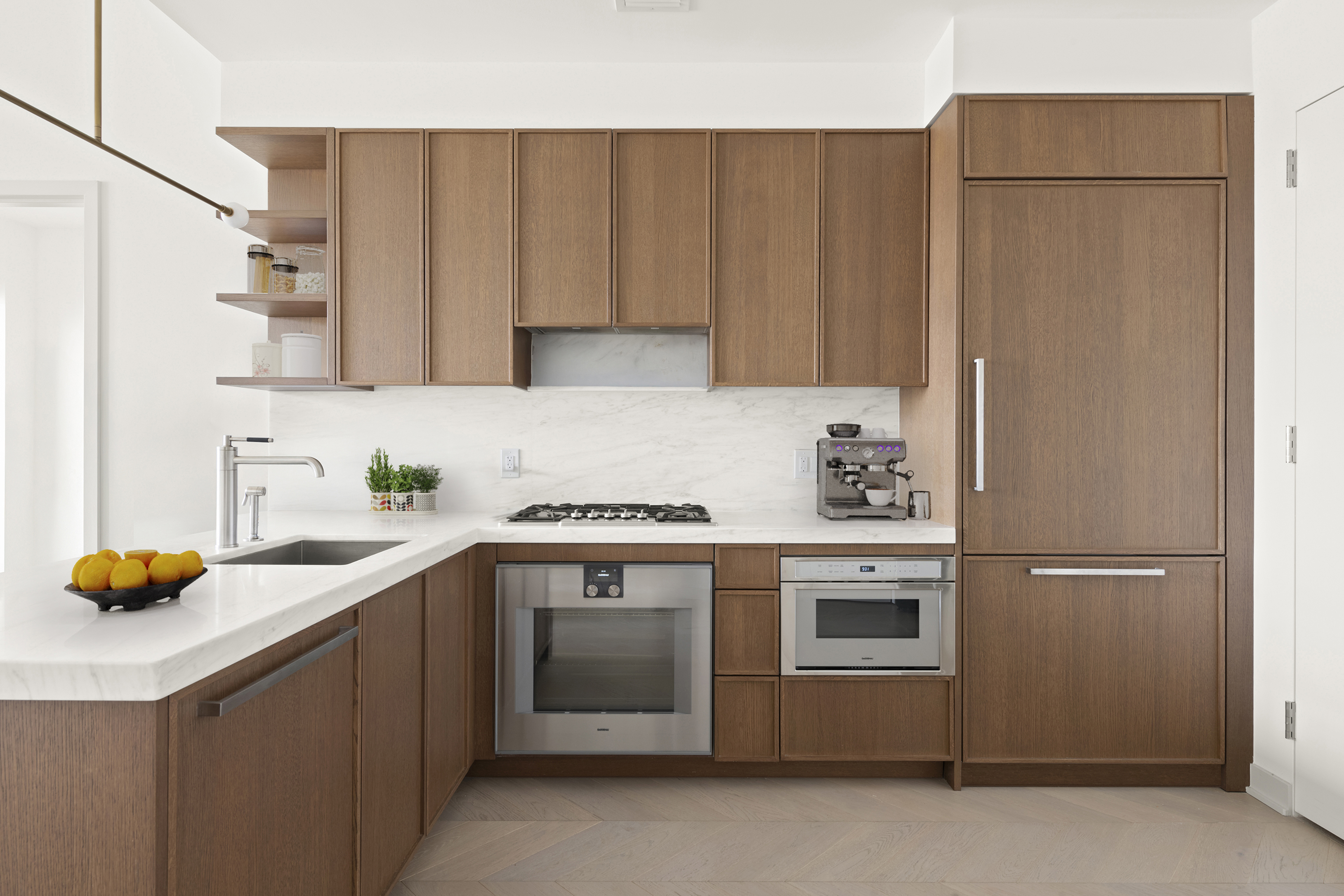 180 Front Street, Unit 7B Brooklyn, NY 11201 - Photo 4 of 25 a kitchen with stainless steel appliances a stove a sink and a refrigerator