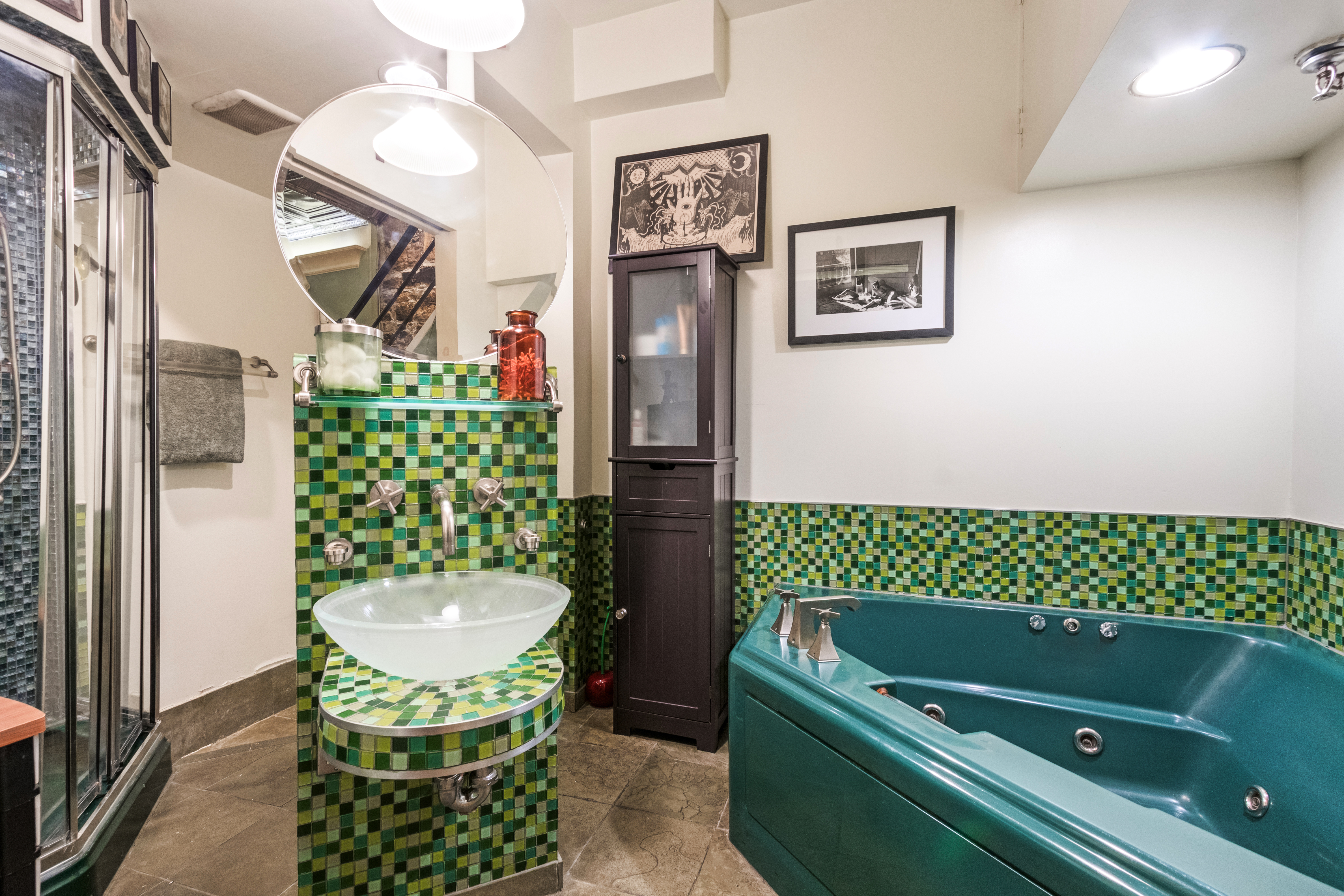 324 Pearl Street, Unit 1F Manhattan, NY 10038 - Photo 11 of 12 a bathroom with a sink a mirror and a bathtub