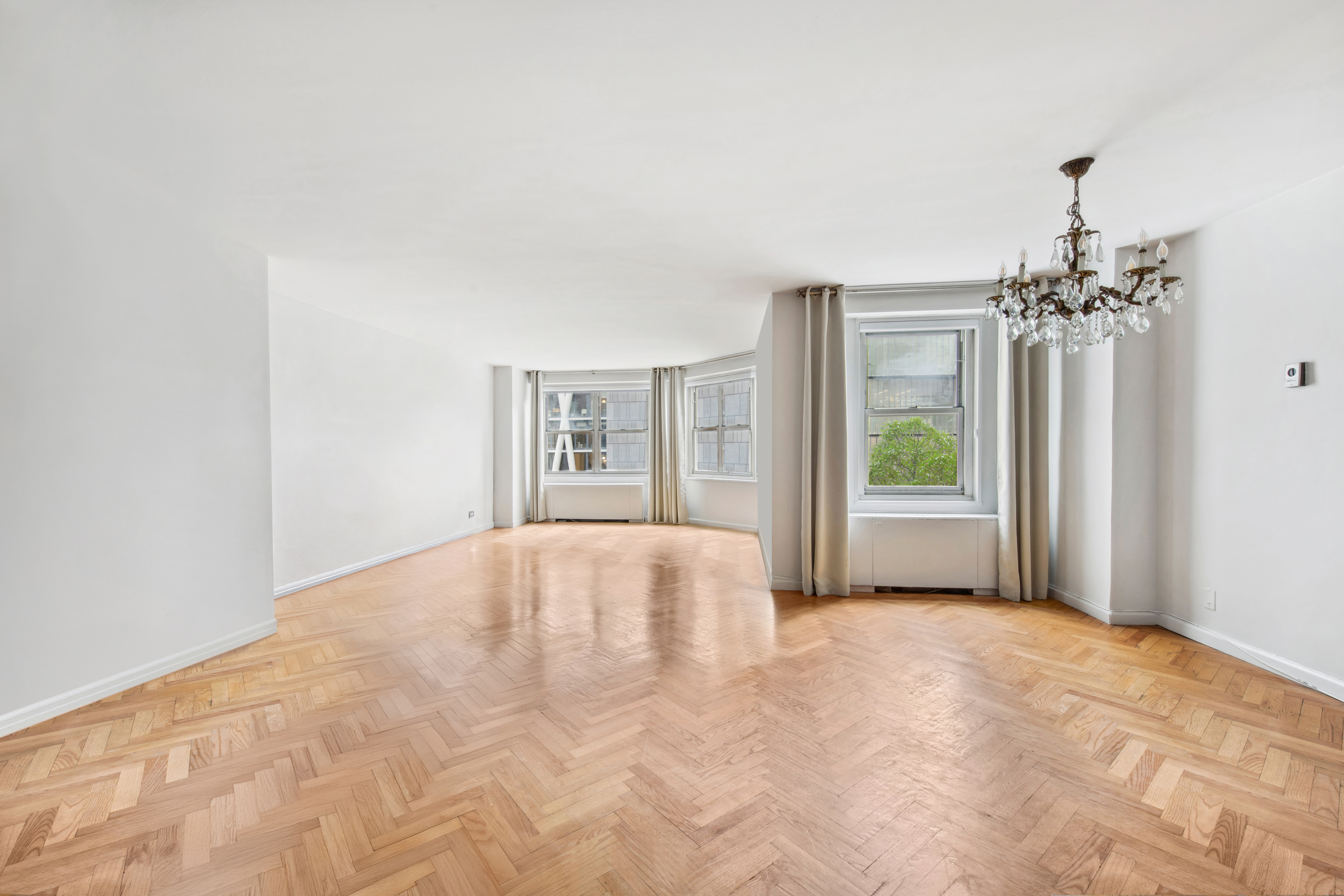 155 West 68th Street, Unit 404 Manhattan, NY 10023 - Photo 2 of 21 a view of an empty room with a window