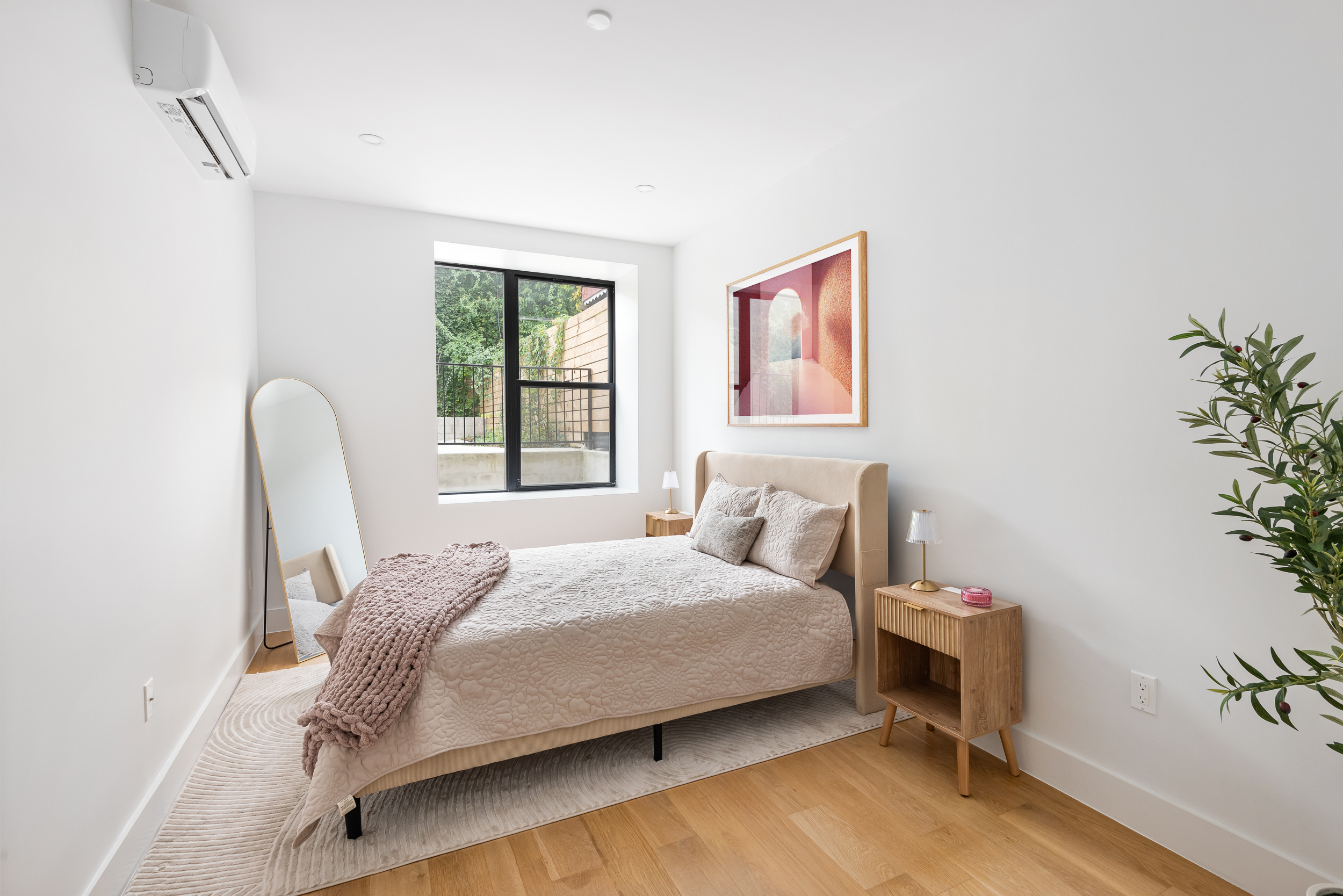 140 Moffat Street, Unit 1 Brooklyn, NY 11207 - Photo 5 of 9 a bedroom with a bed and a chair