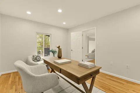 a bedroom with a bed and a potted plant