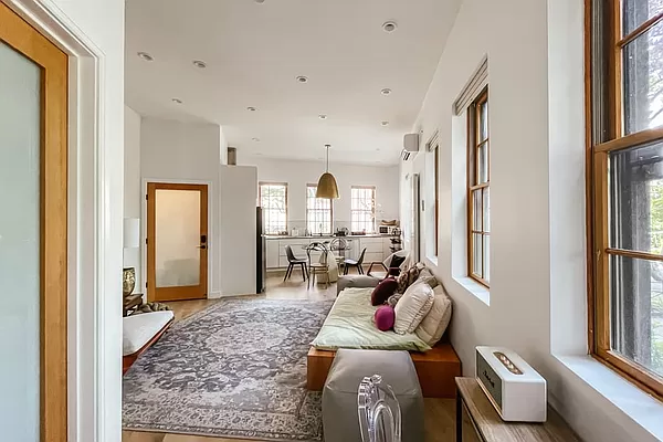 334 Plymouth Street Brooklyn, NY 11201 - Photo 22 of 32 a living room with furniture fireplace and a window