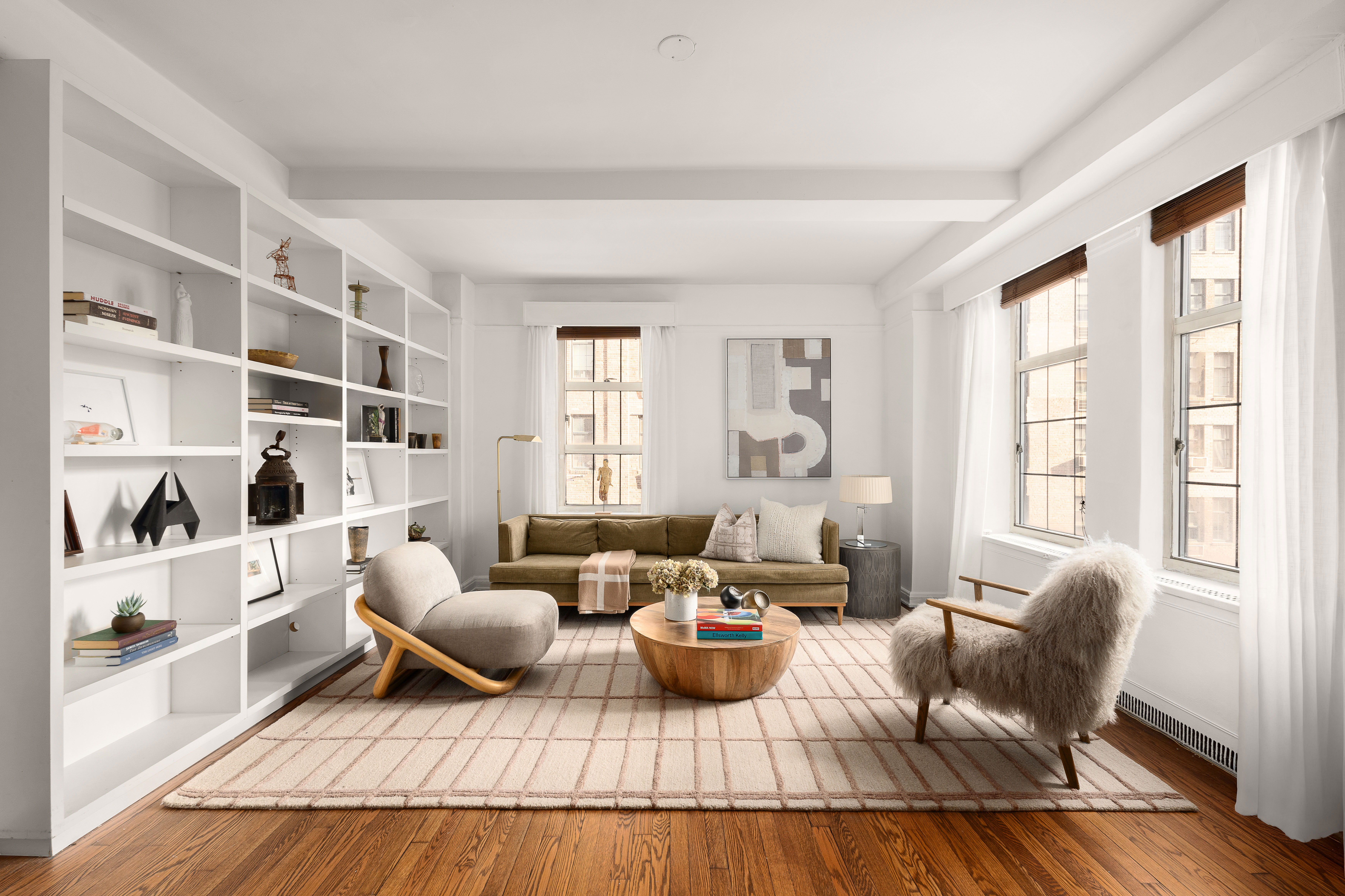 465 West 23rd Street, Unit 10A Manhattan, NY 10011 - Photo 1 of 12 a living room with furniture and a window