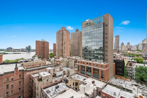 a view of city with tall buildings