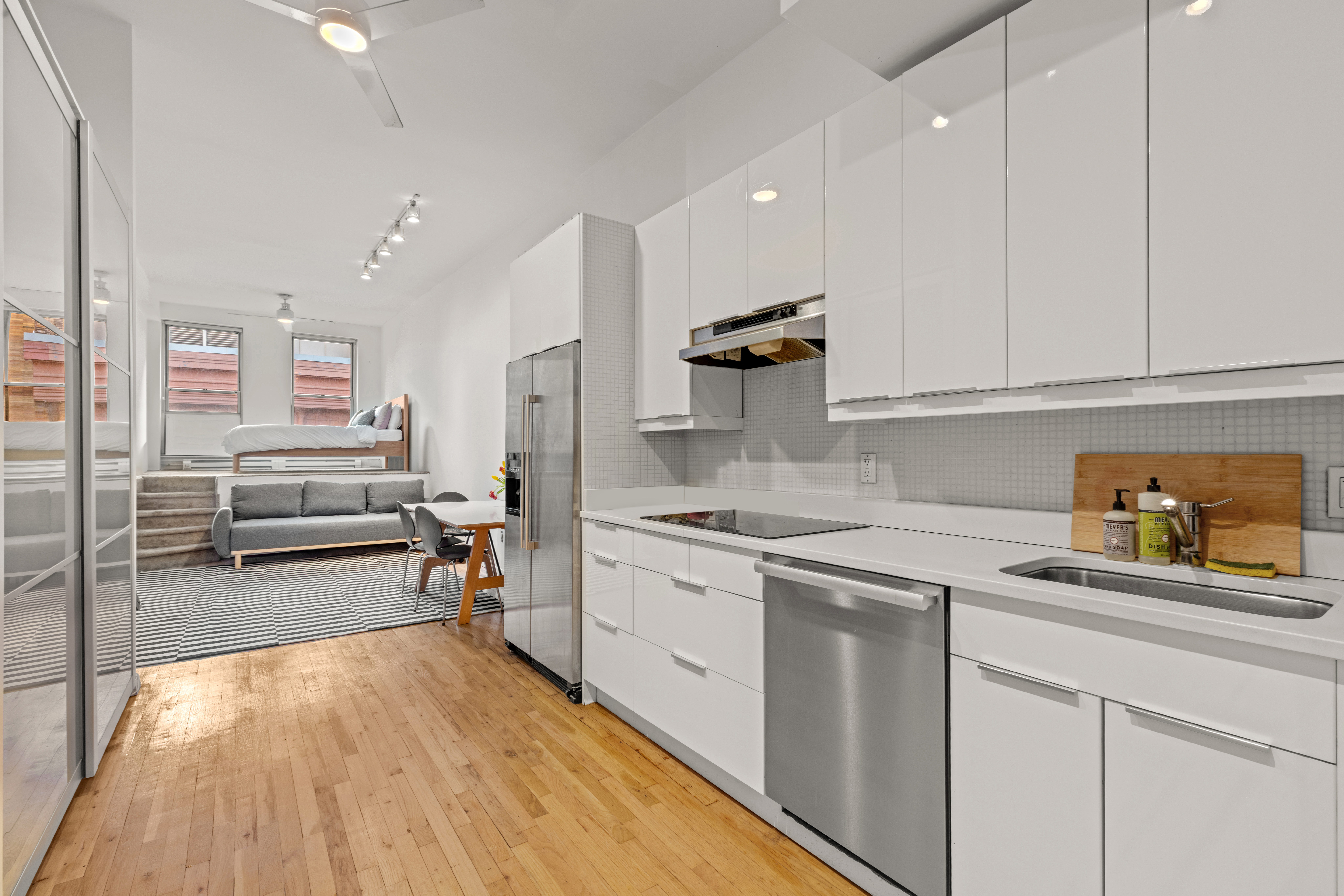 23 Waverly Place, Unit 6M Manhattan, NY 10003 - Photo 3 of 22 a kitchen with a sink a stove and cabinets