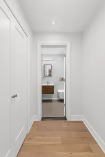 a view of a bathroom from a hallway