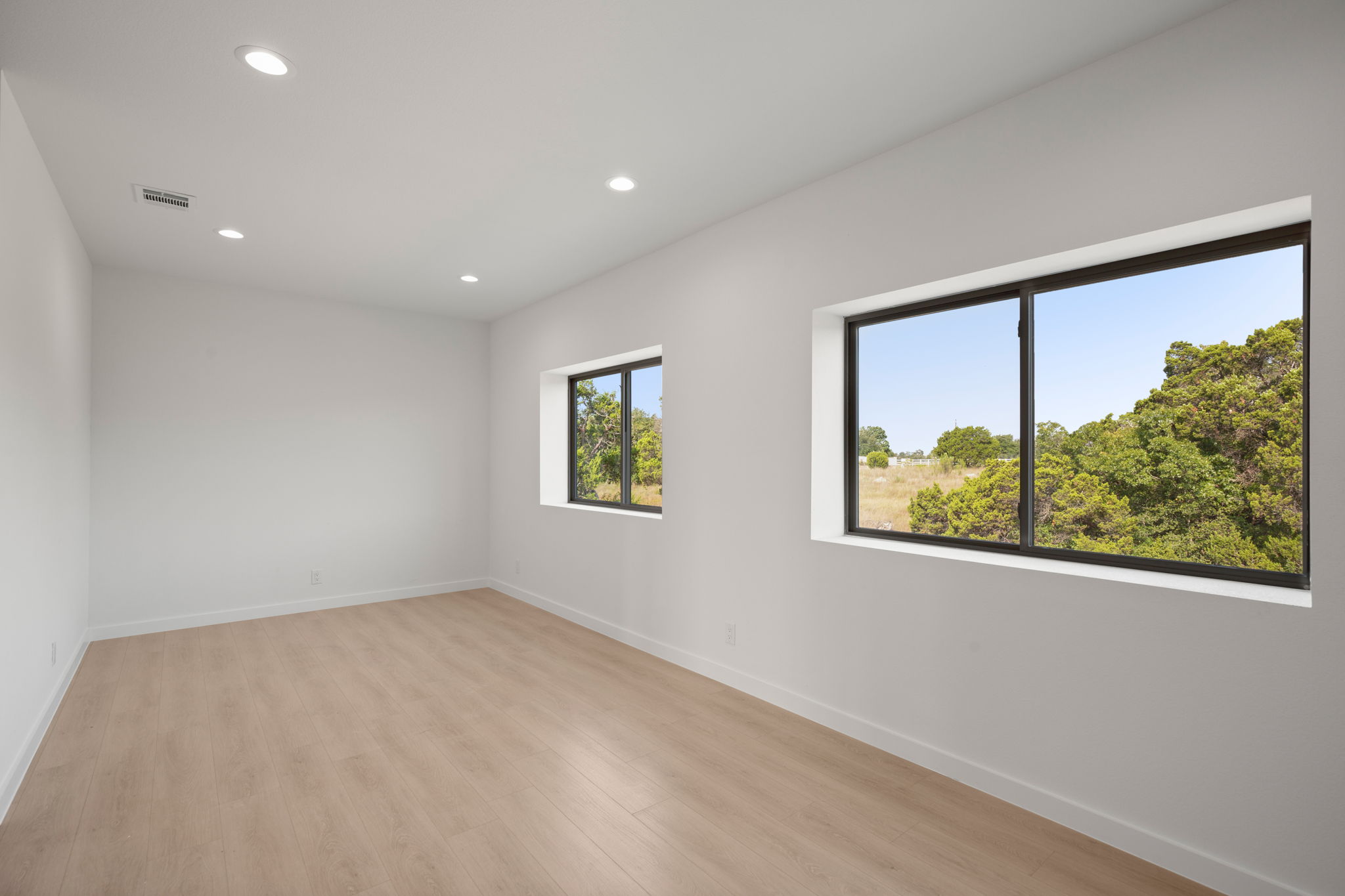 10020 Darden Hill Road, Unit 401 Austin, TX 78737 - Photo 29 of 50 an empty room with windows