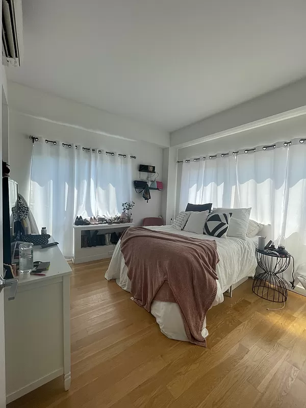 500 Sterling Place, Unit 3H Brooklyn, NY 11238 - Photo 2 of 12 a spacious bedroom with a bed and a view of kitchen