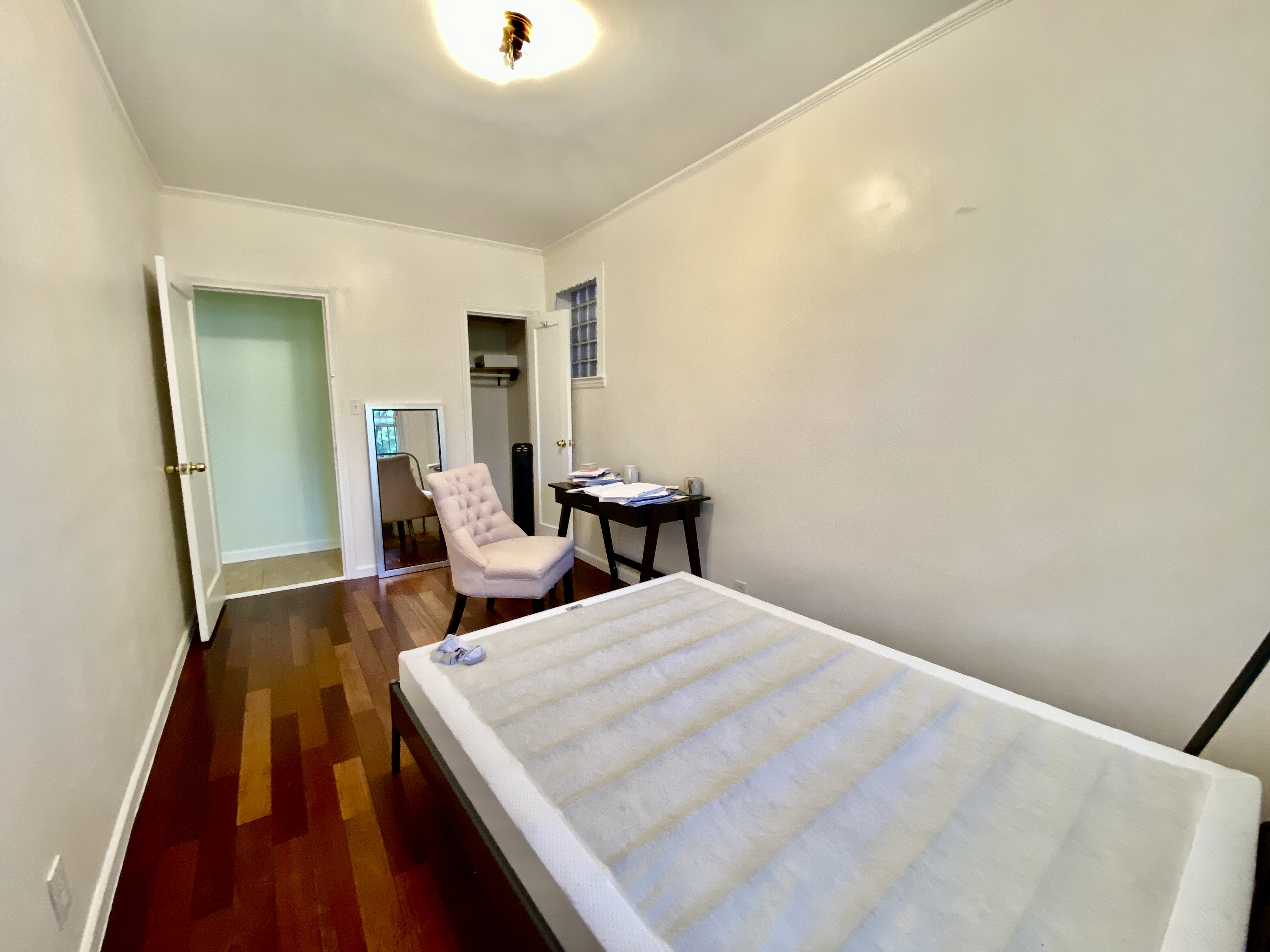 156 96th Street, Unit 1 Brooklyn, NY 11209 - Photo 6 of 7 a bedroom with a bed and wooden floor