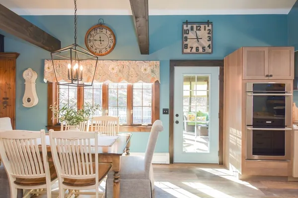 a view of a dining room with furniture window and outside view