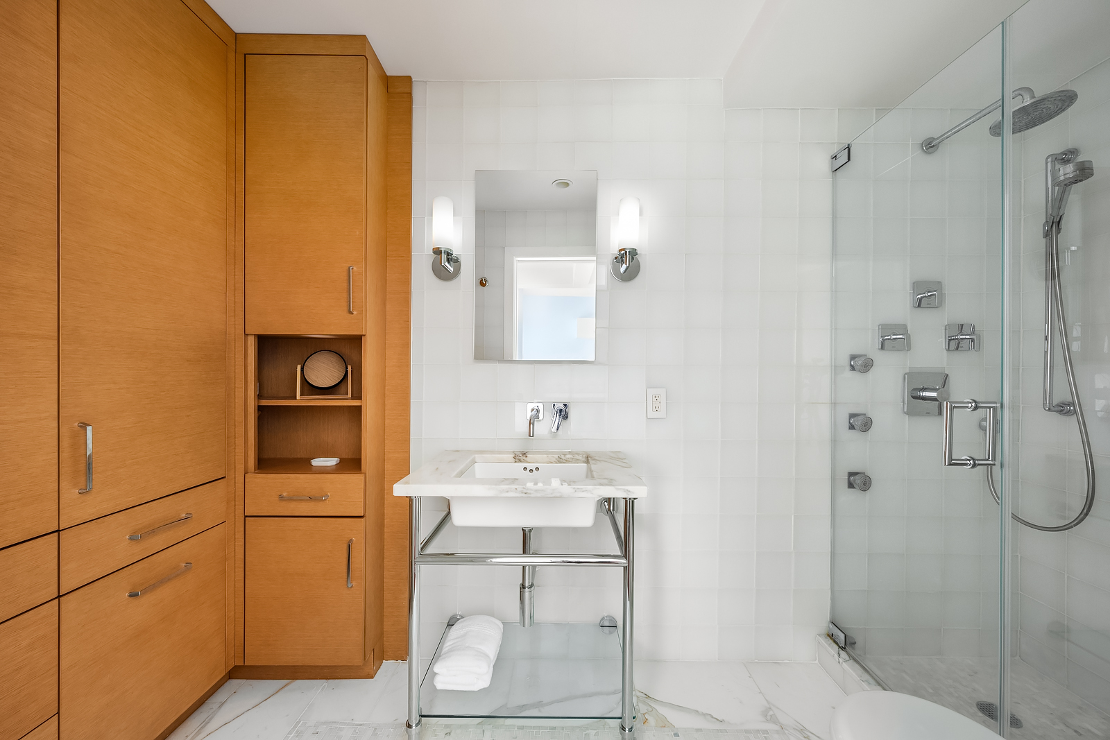 2166 Broadway, Unit 5D Manhattan, NY 10024 - Photo 7 of 11 a bathroom with a sink a toilet and shower