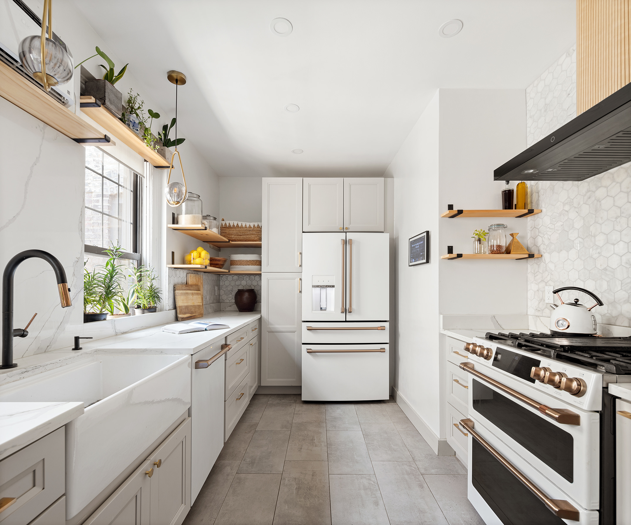 370 Central Park West, Unit PH601 Manhattan, NY 10025 - Photo 6 of 19 a kitchen with white cabinets and white appliances