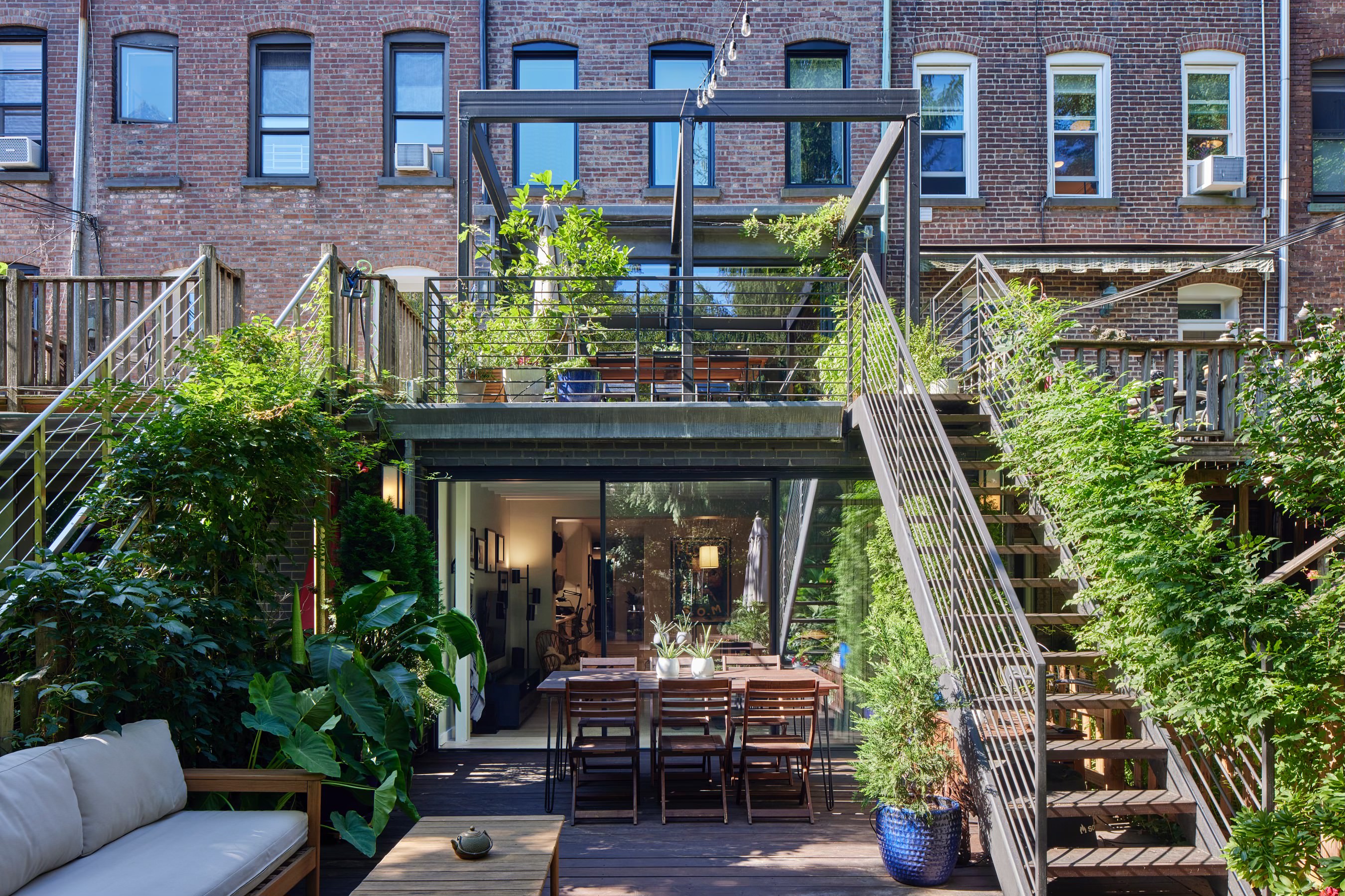 171 Garfield Place Brooklyn, NY 11215 - Photo 17 of 19 a view of house with outdoor seating and flowers