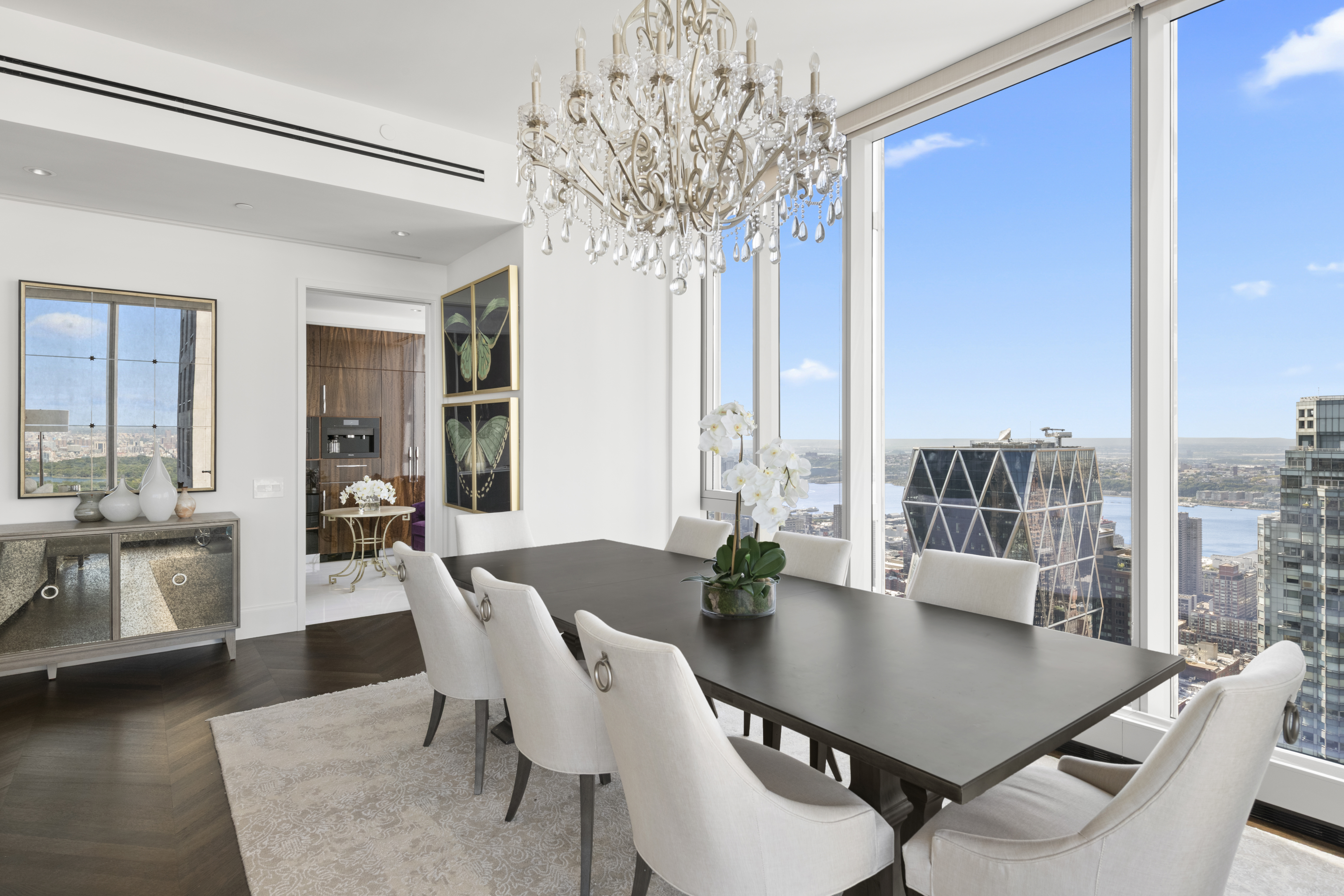 217 West 57th Street, Unit 58W Manhattan, NY 10019 - Photo 5 of 30 a view of a dining room with furniture window and wooden floor