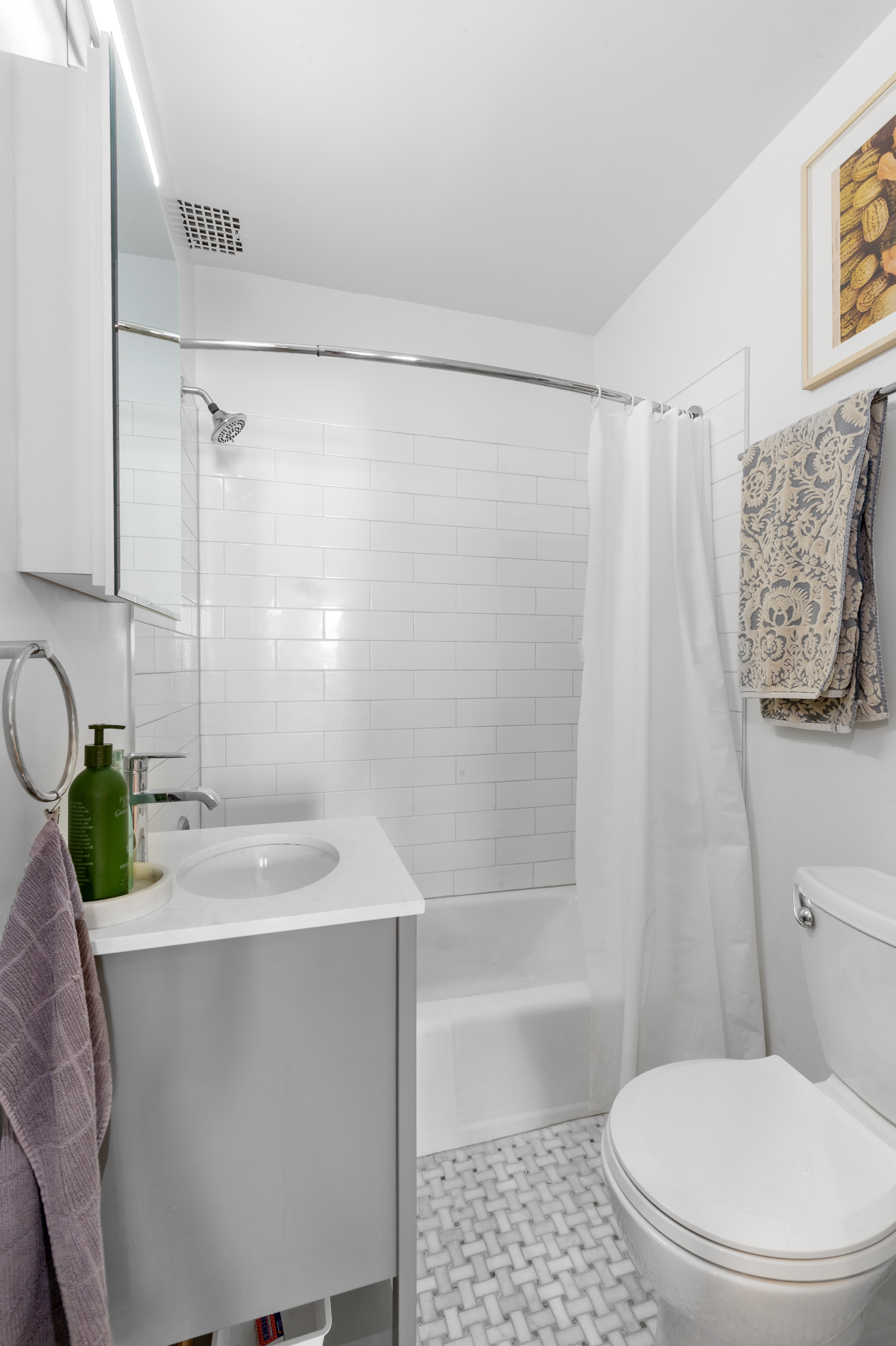 122 West 80th Street, Unit 3F Manhattan, NY 10024 - Photo 6 of 15 a bathroom with a sink toilet and shower