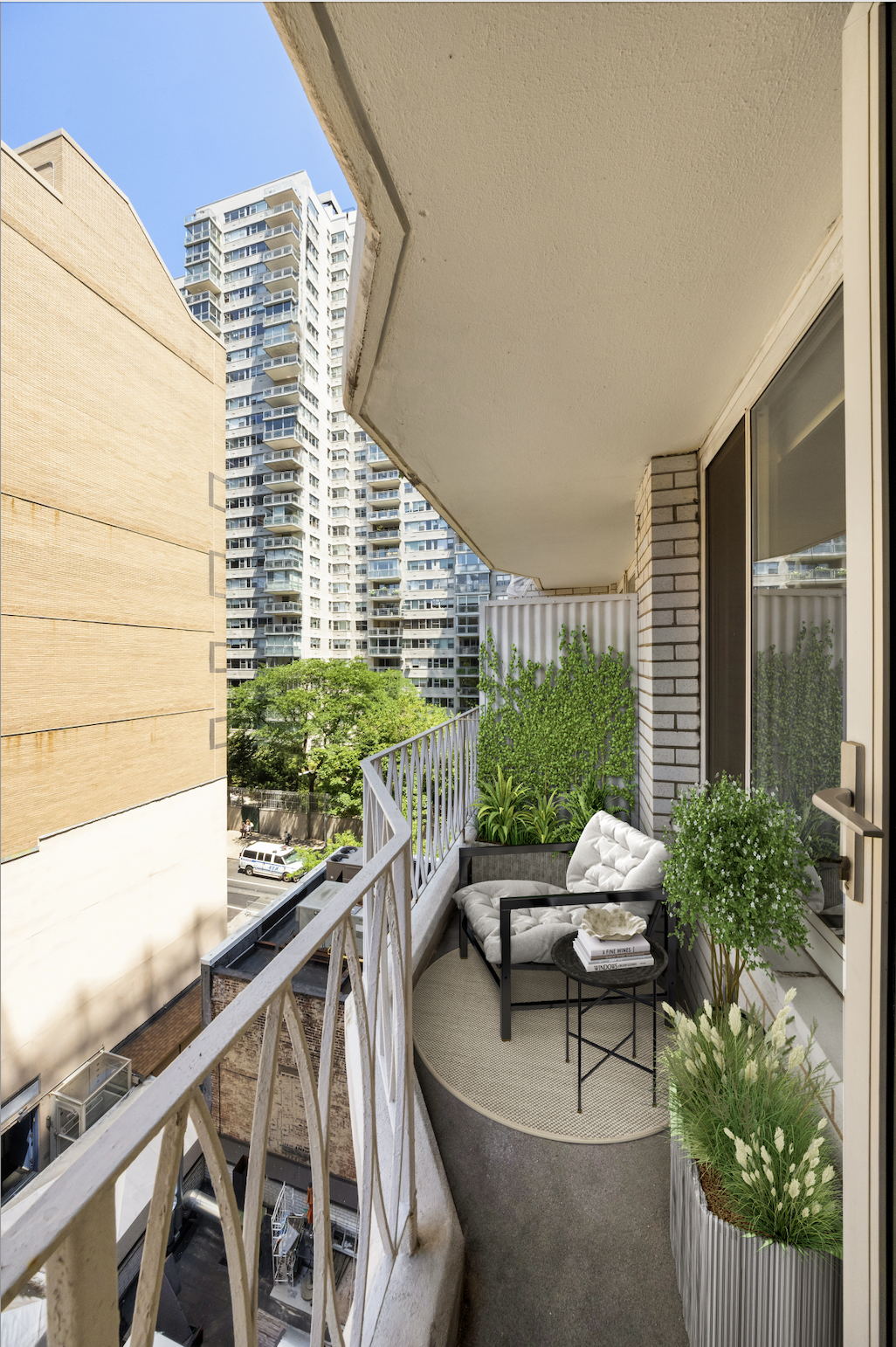1160 3rd Avenue, Unit 7C Manhattan, NY 10065 - Photo 2 of 7 a balcony with outdoor seating and plants