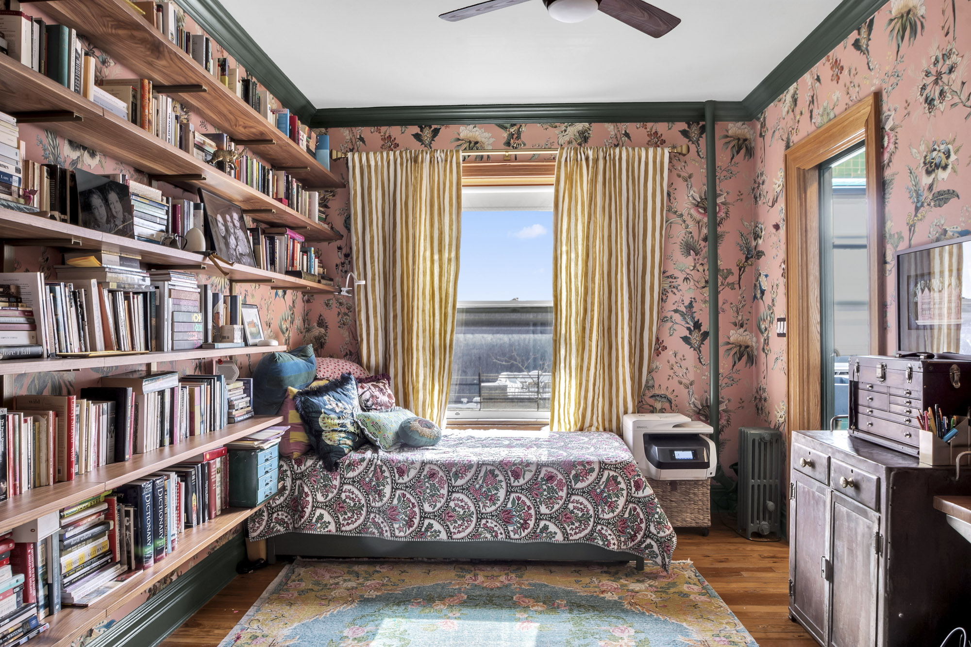 275 Clinton Avenue, Unit 4-1 Brooklyn, NY 11205 - Photo 15 of 20 a bed room with a bed and a book shelf