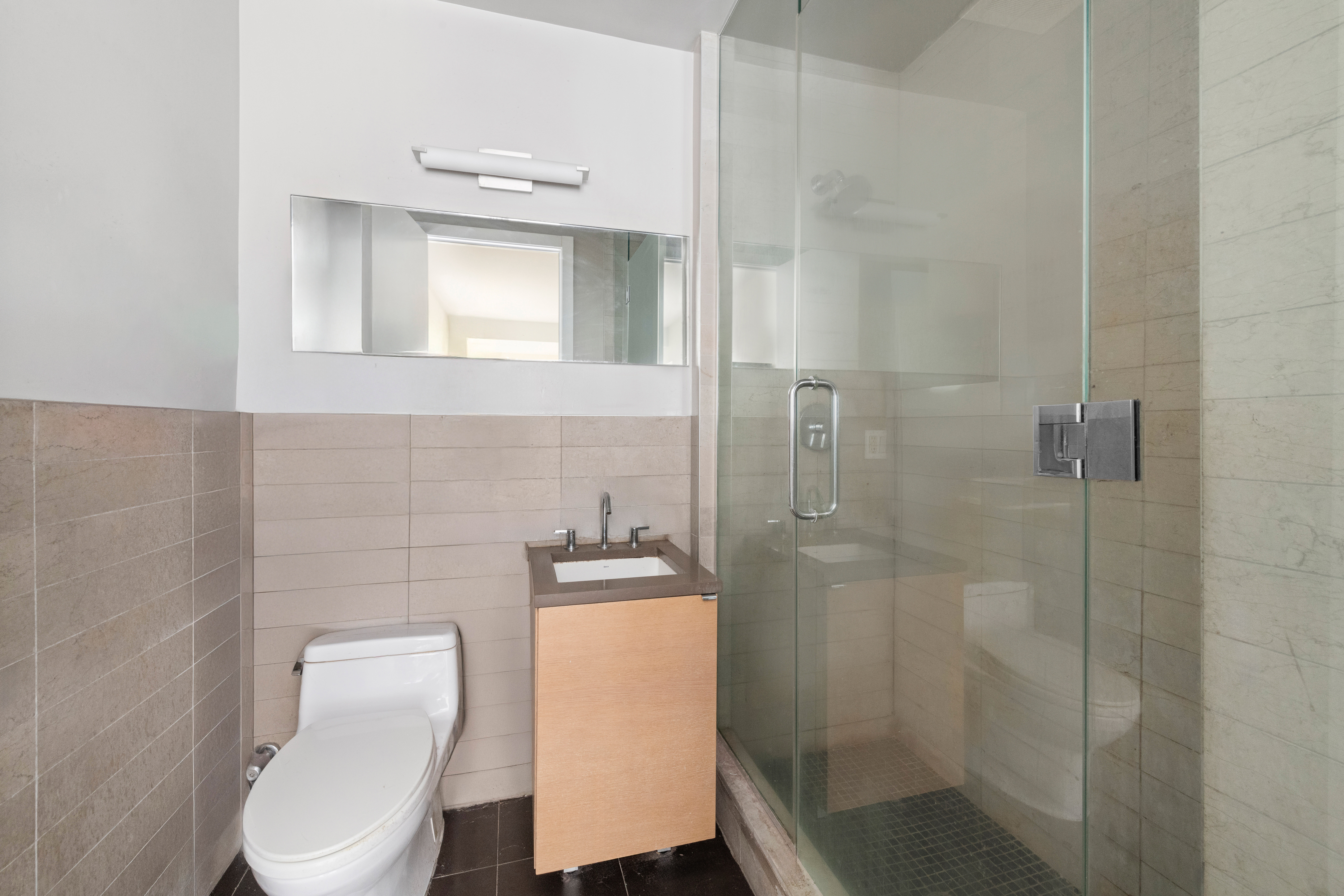 50 Bayard Street, Unit 3J Brooklyn, NY 11211 - Photo 6 of 13 a bathroom with a toilet and a shower