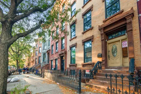 a view of a building with sitting area