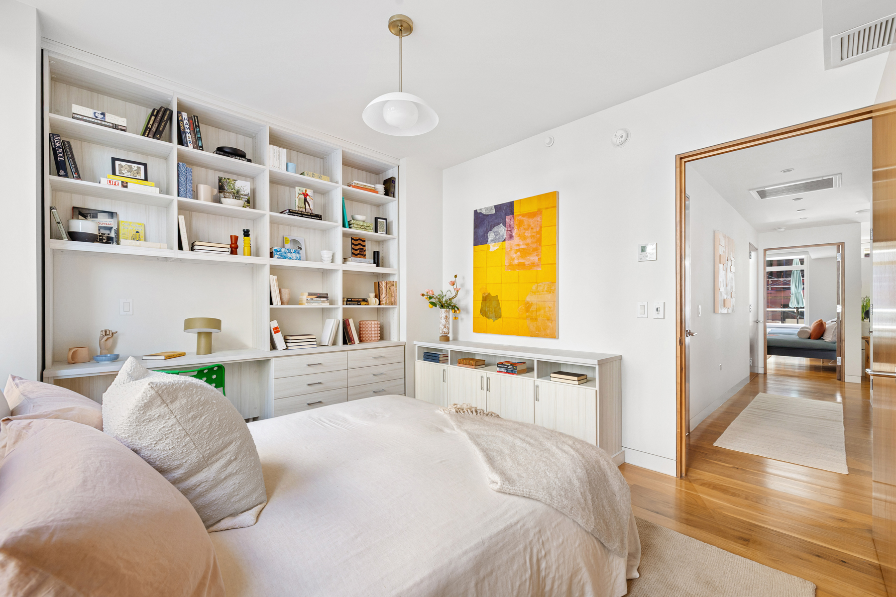 151 West 21st Street, Unit 10A Manhattan, NY 10011 - Photo 16 of 26 a bedroom with a bed and a cabinets