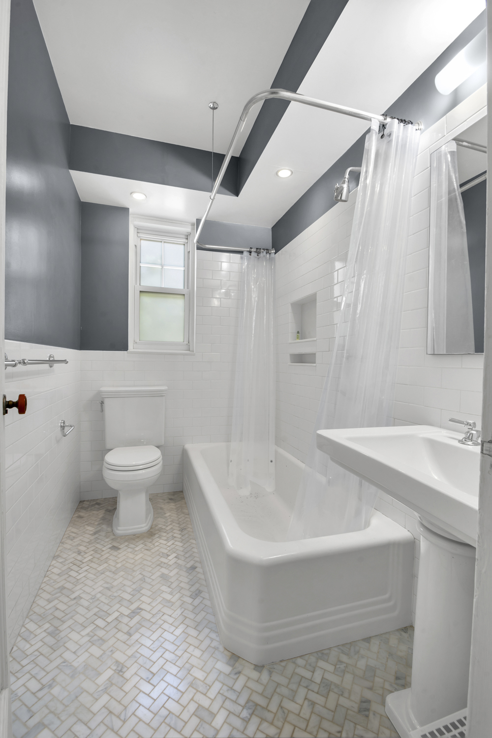 140 Cabrini Boulevard, Unit 14 Manhattan, NY 10033 - Photo 10 of 30 a bathroom with a sink a toilet and a bathtub