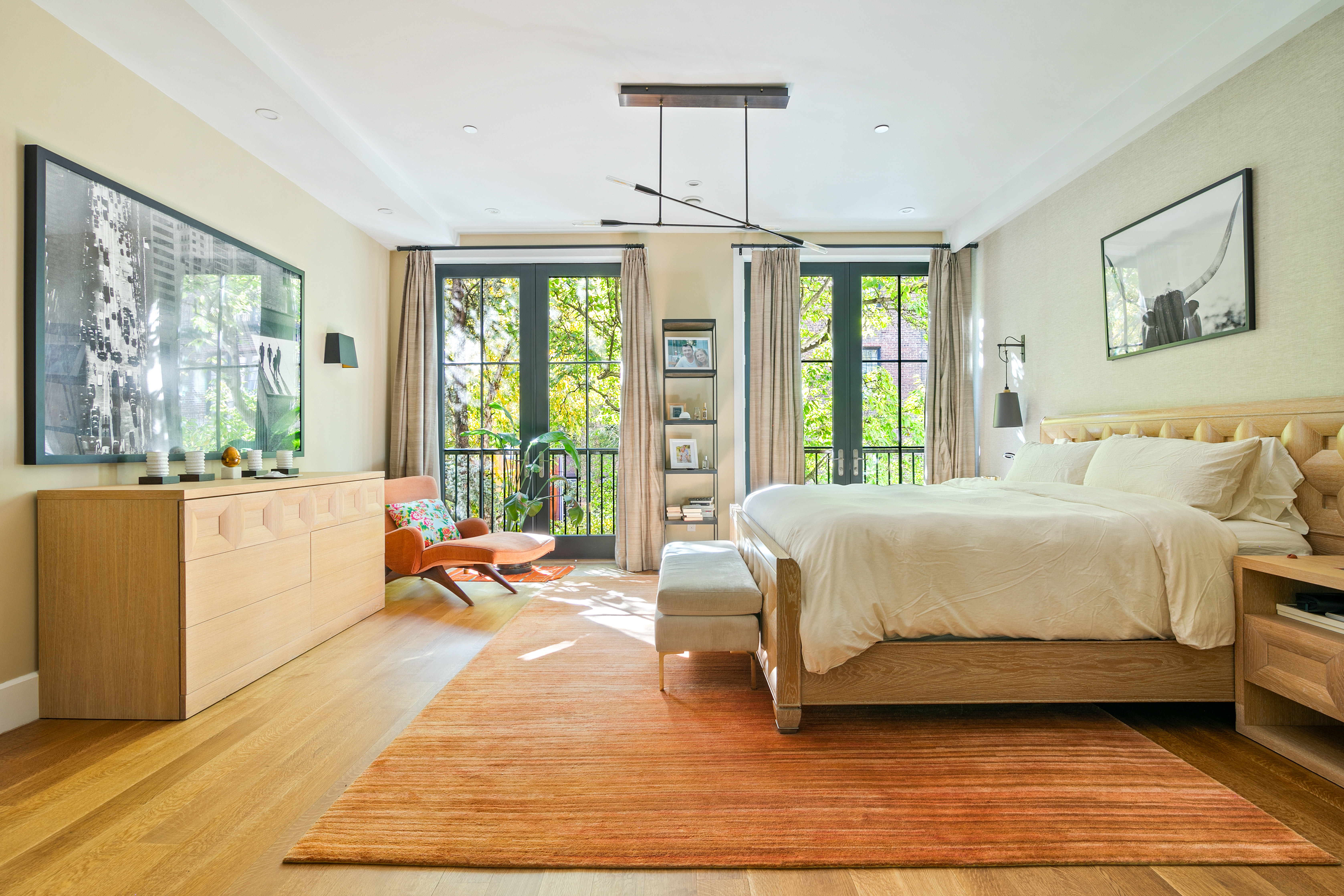 152 West 13th Street Manhattan, NY 10011 - Photo 14 of 28 a spacious bedroom with a large bed and a large window