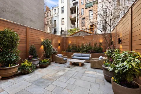 a view of a patio with sitting area