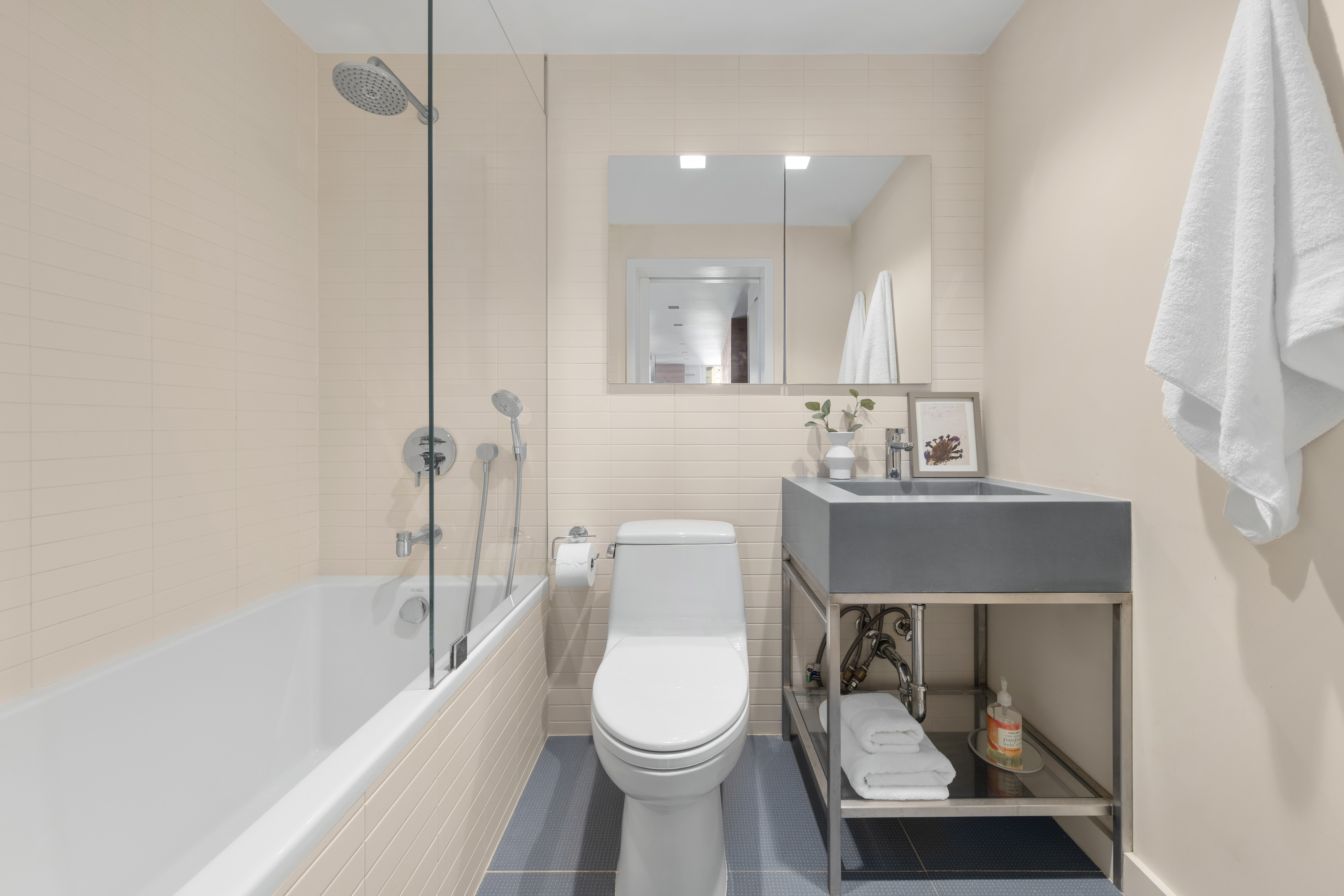1 Irving Place, Unit G20A Manhattan, NY 10003 - Photo 9 of 14 a bathroom with a toilet a sink and bathtub