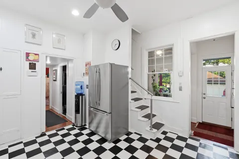 a kitchen with stainless steel appliances a refrigerator and a stove