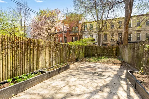 a pathway of a house with a yard