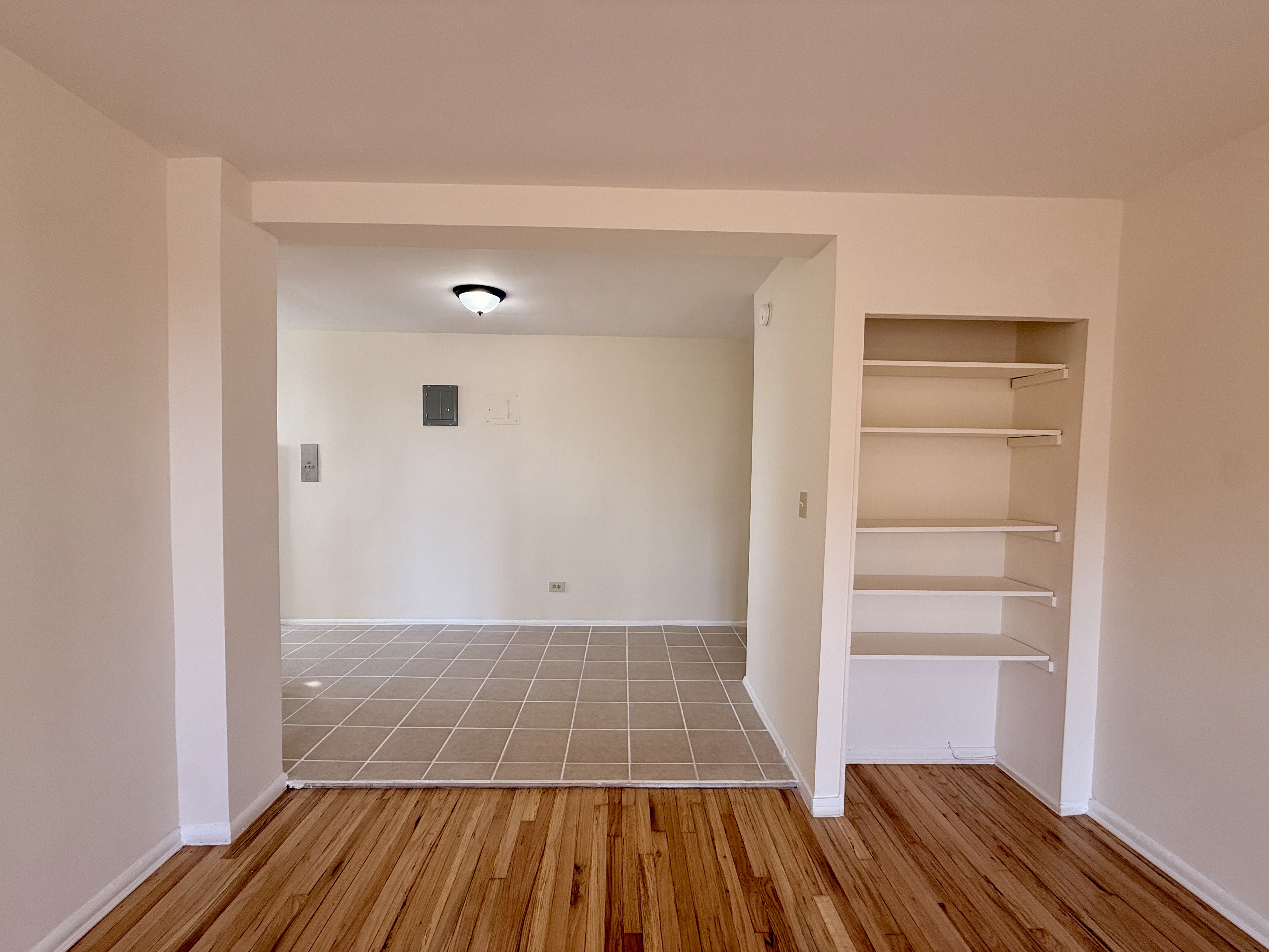 230 73rd Street, Unit 4B Brooklyn, NY 11209 - Photo 5 of 9 a view of a room with wooden floor and closet