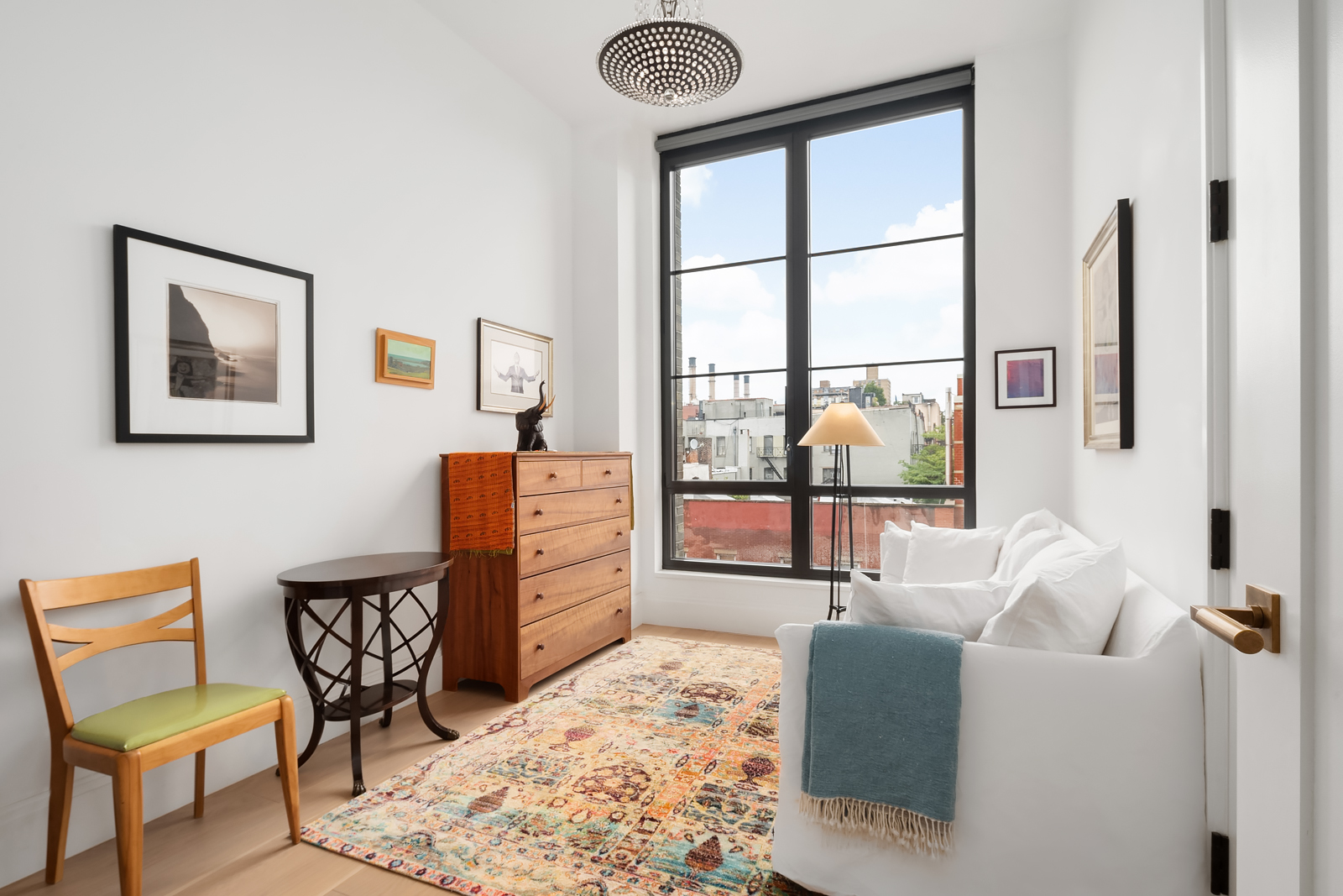 438 East 12th Street, Unit 6F Manhattan, NY 10009 - Photo 11 of 27 a bedroom with furniture and a window