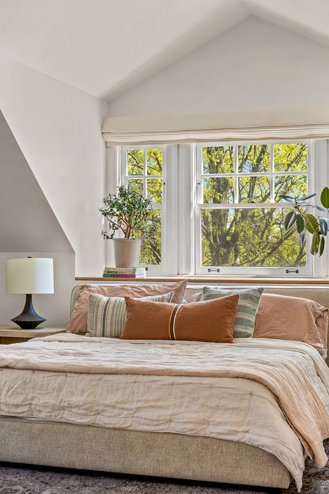 a white bath tub sitting next to a window