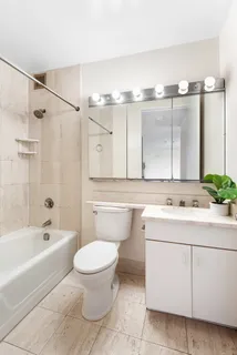a bathroom with a sink a toilet and a bathtub