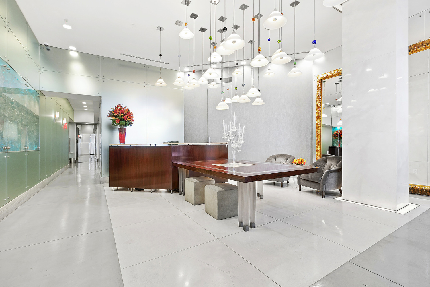 207 East 57th Street, Unit 34A Manhattan, NY 10022 - Photo 17 of 22 a room with table chairs and a chandelier