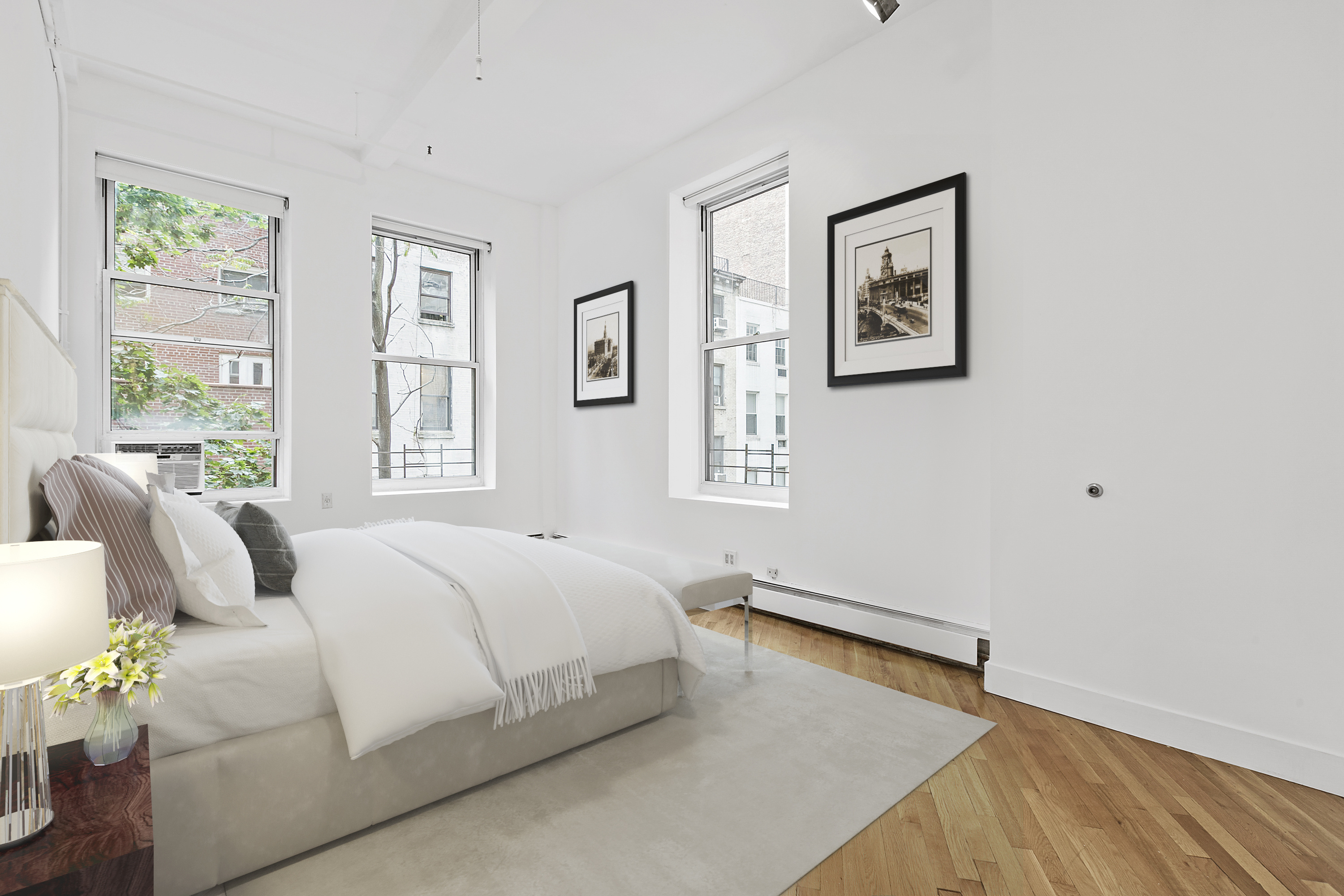 40 West 17th Street, Unit 3B Manhattan, NY 10011 - Photo 5 of 7 a bedroom with a bed couch and window