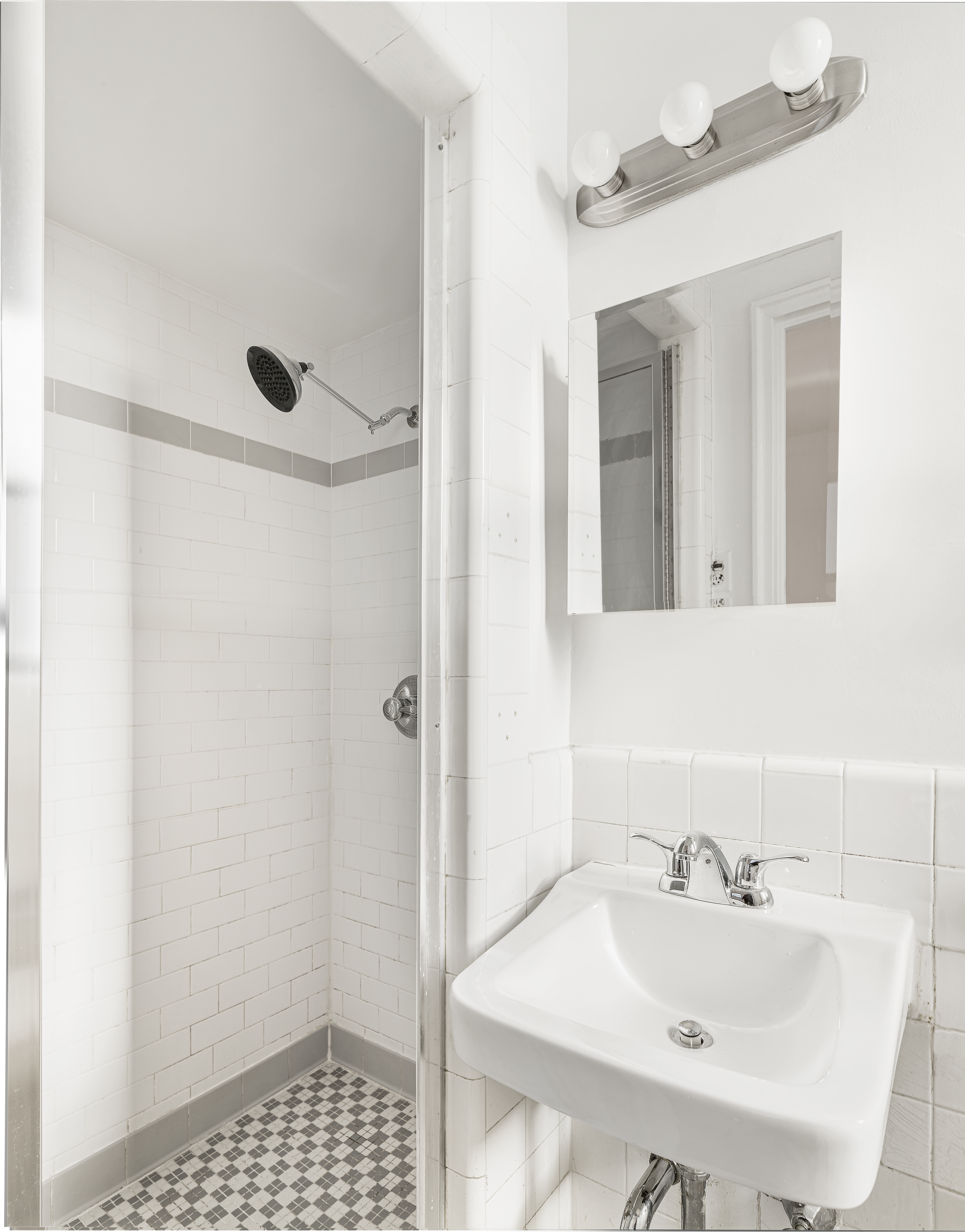 158-18 Riverside Drive West, Unit 4E50 Manhattan, NY 10032 - Photo 7 of 17 a bathroom with a sink and a mirror