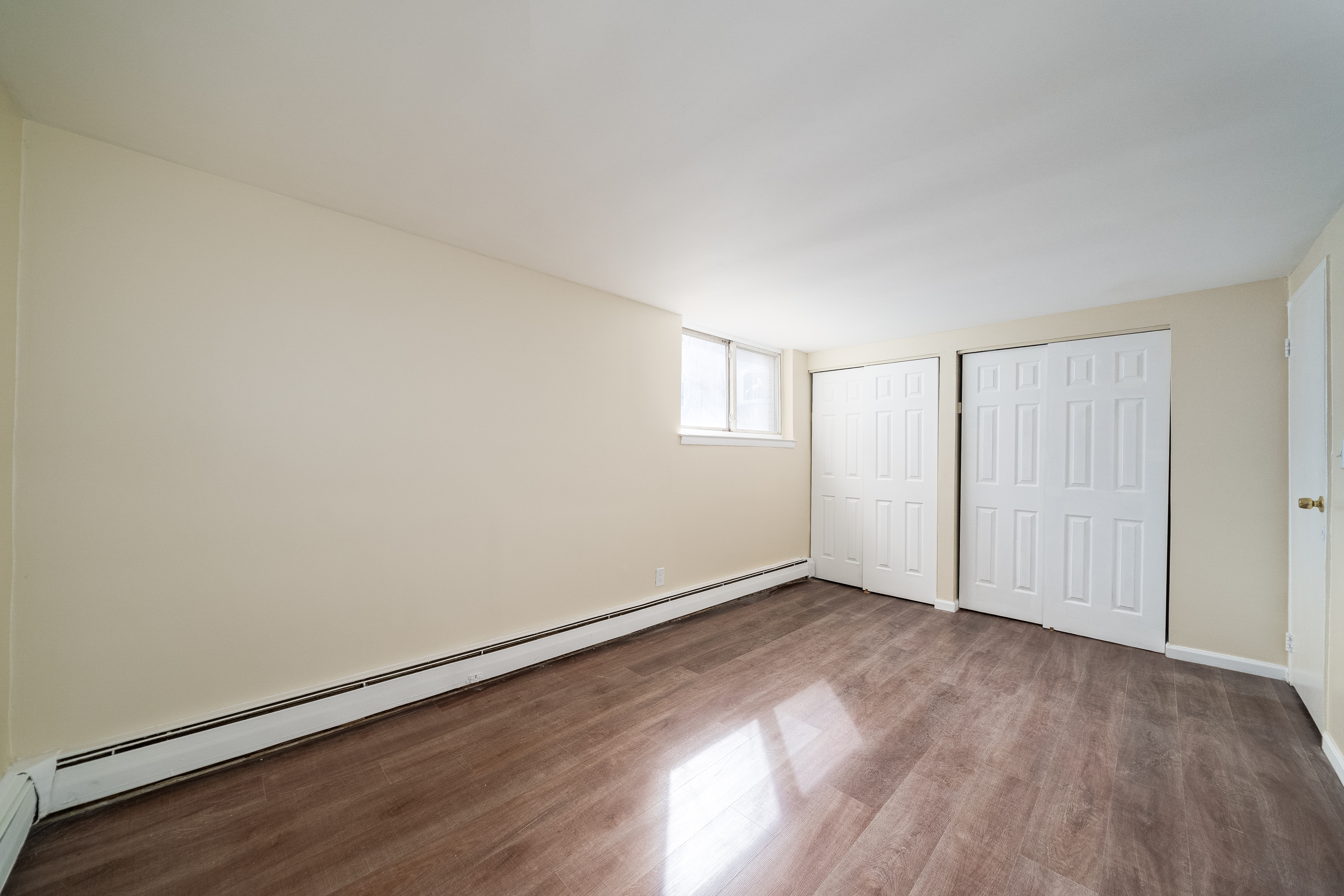 100-108 35th Street Union City, NJ 07087 - Photo 15 of 17 an empty room with wooden floor and windows