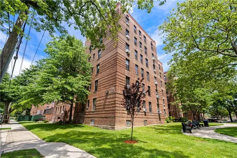 a view of a building with a yard