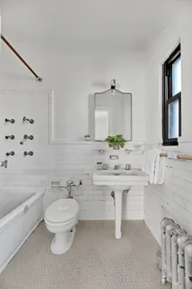 a bathroom with a sink toilet a tub and shower