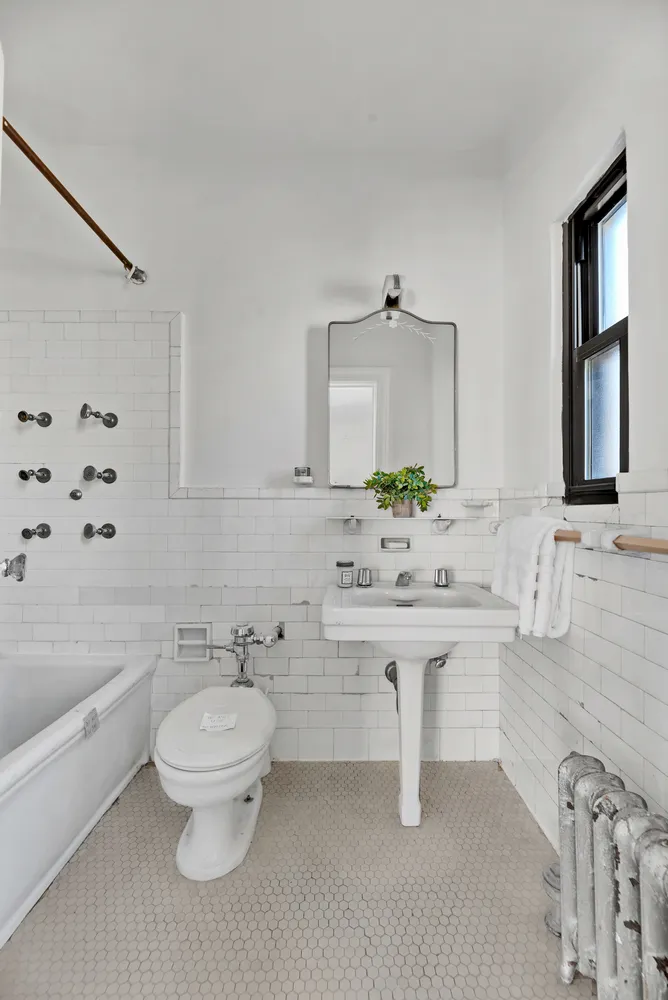 a bathroom with a sink toilet a tub and shower