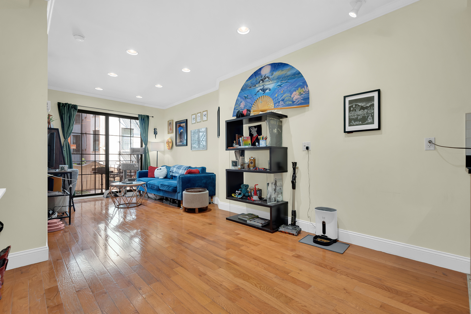 111 West 113th Street, Unit 3B Manhattan, NY 10026 - Photo 2 of 7 a living room with furniture and a wooden floor