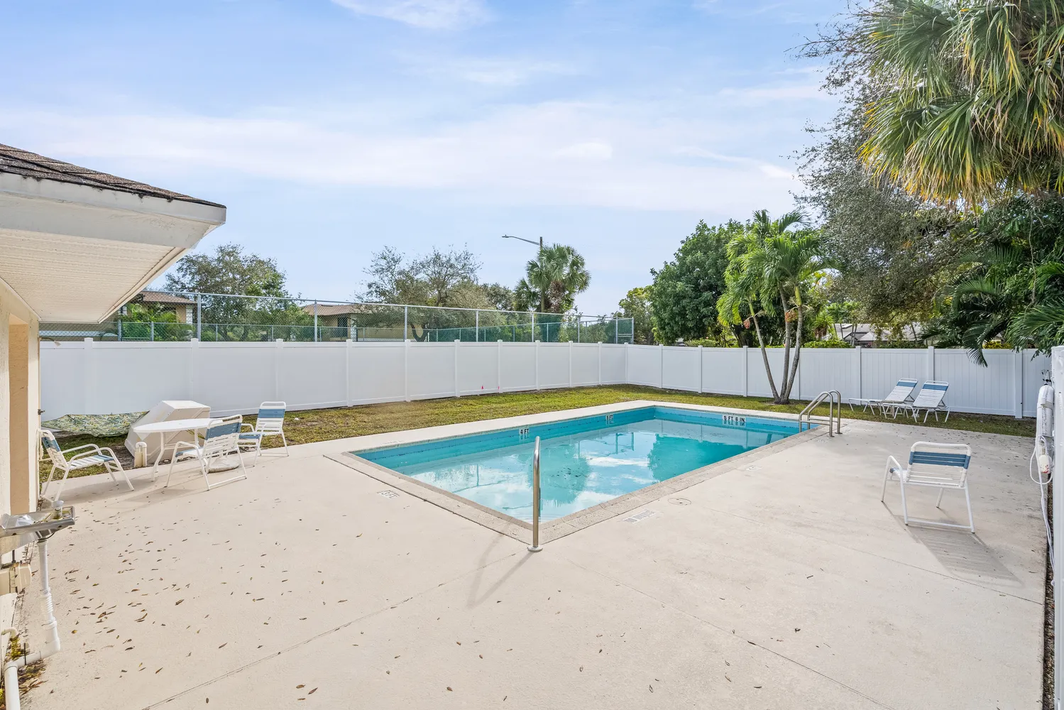 a view of a swimming pool and lounge chair