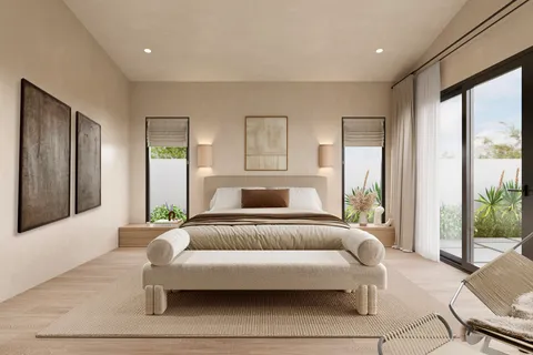 a bedroom with a bed and glass window