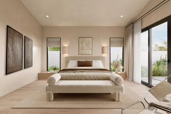 a bedroom with a bed and glass window