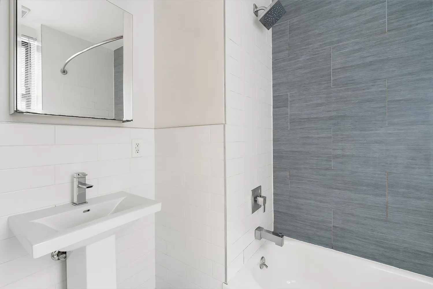 a bathroom with a sink and mirror